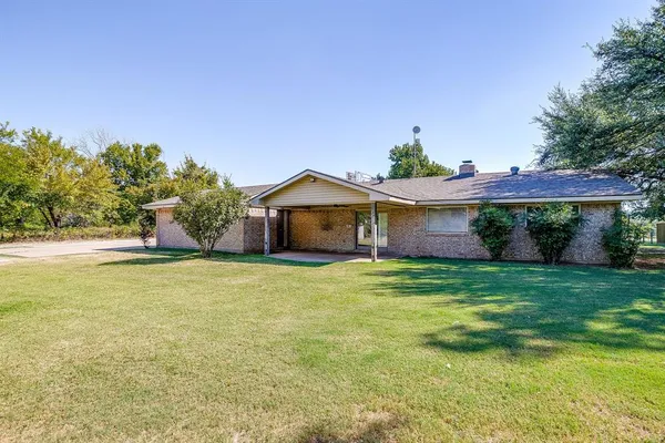 a view of a house with a garden