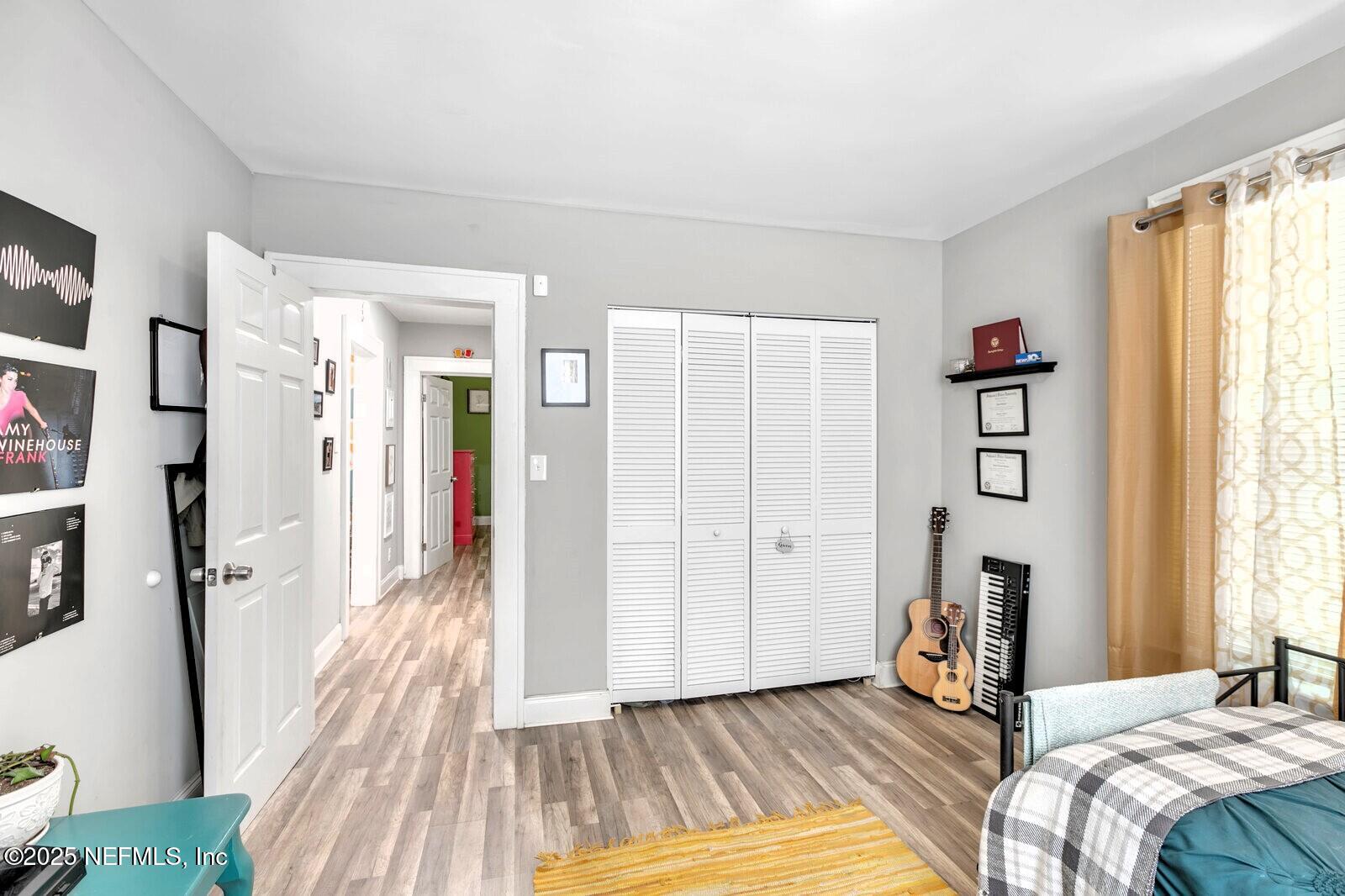 1336 Rushing Street Jacksonville, FL 32209 - Photo 10 of 19 a bedroom with a bed and a mirror