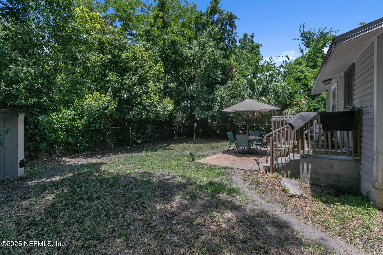 1336 Rushing Street Jacksonville, FL 32209 - Photo 16 of 19 a view of backyard with green space and outdoor seating
