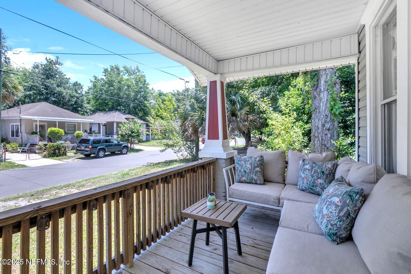 1336 Rushing Street Jacksonville, FL 32209 - Photo 7 of 19 a balcony with furniture and a garden