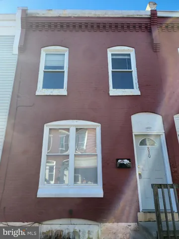 a front view of a house with stairs