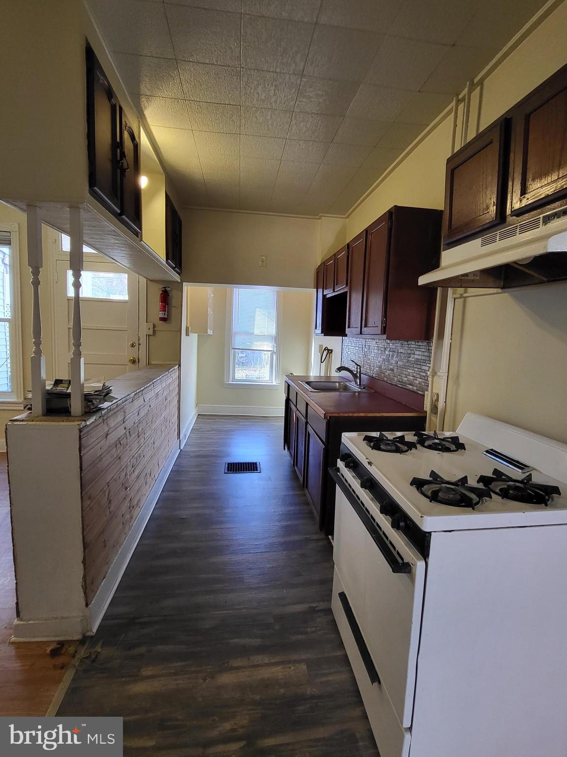 830 Church Street Reading, PA 19601 - Photo 2 of 12 a kitchen with stainless steel appliances granite countertop a stove and a sink