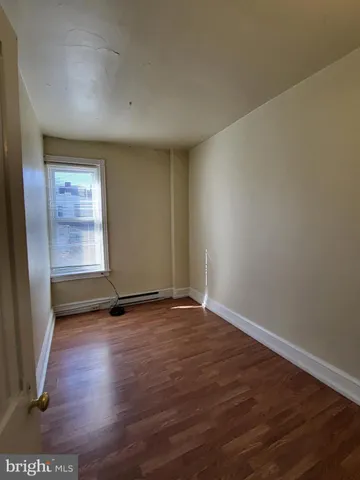 a bathroom with a tub and shower
