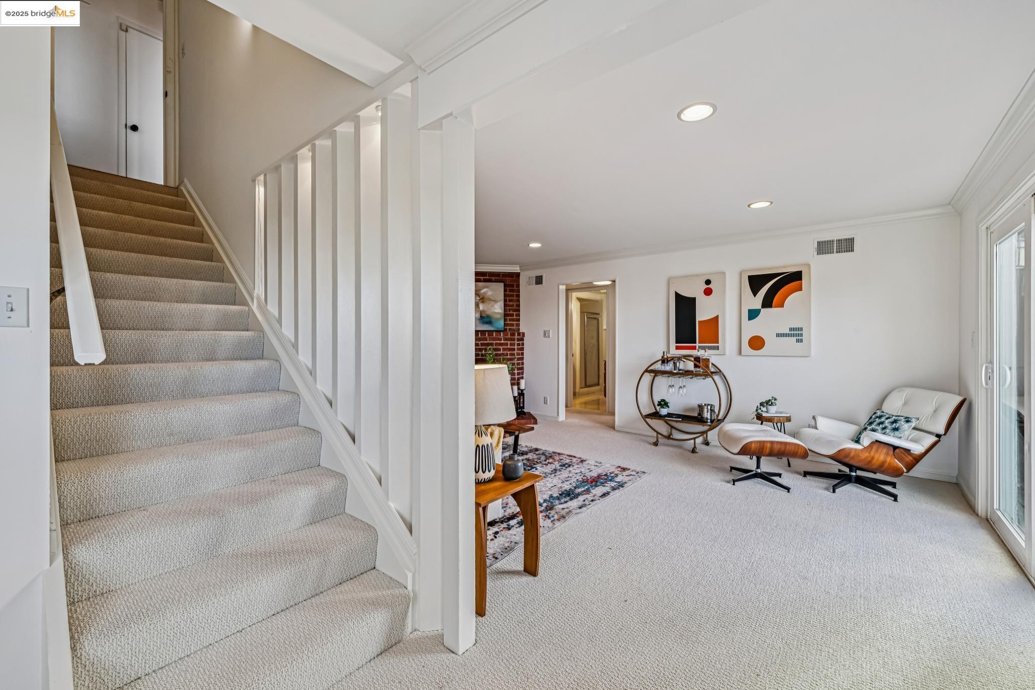 946 Creston Road Berkeley, CA 94708 - Photo 16 of 44 a view of a livingroom with furniture and stairs