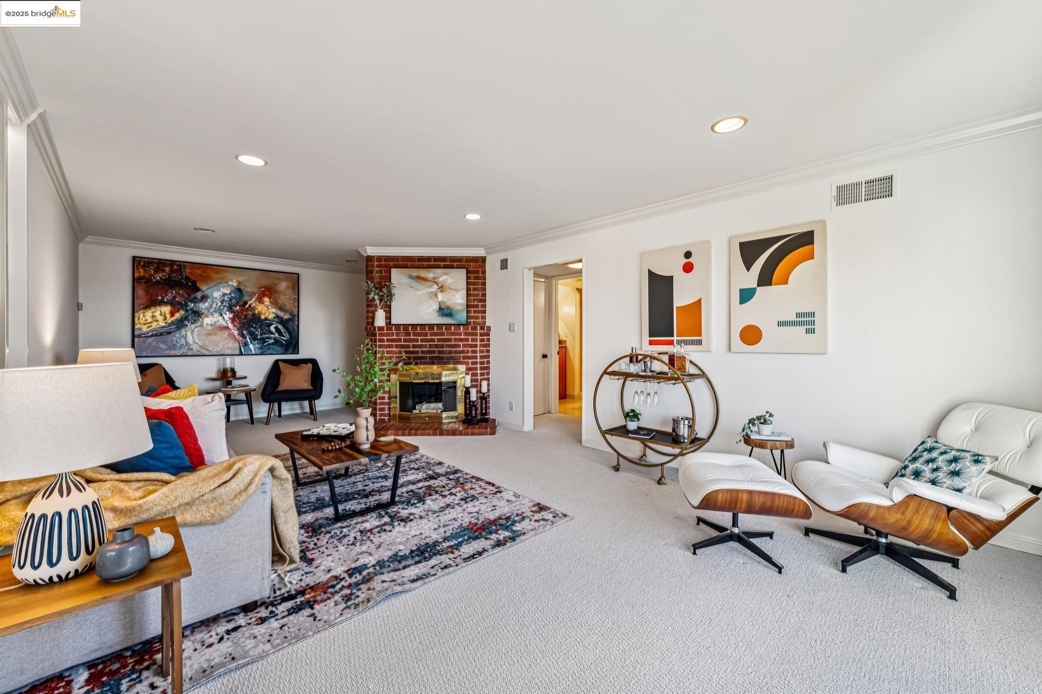 946 Creston Road Berkeley, CA 94708 - Photo 17 of 44 a living room with furniture and a flat screen tv