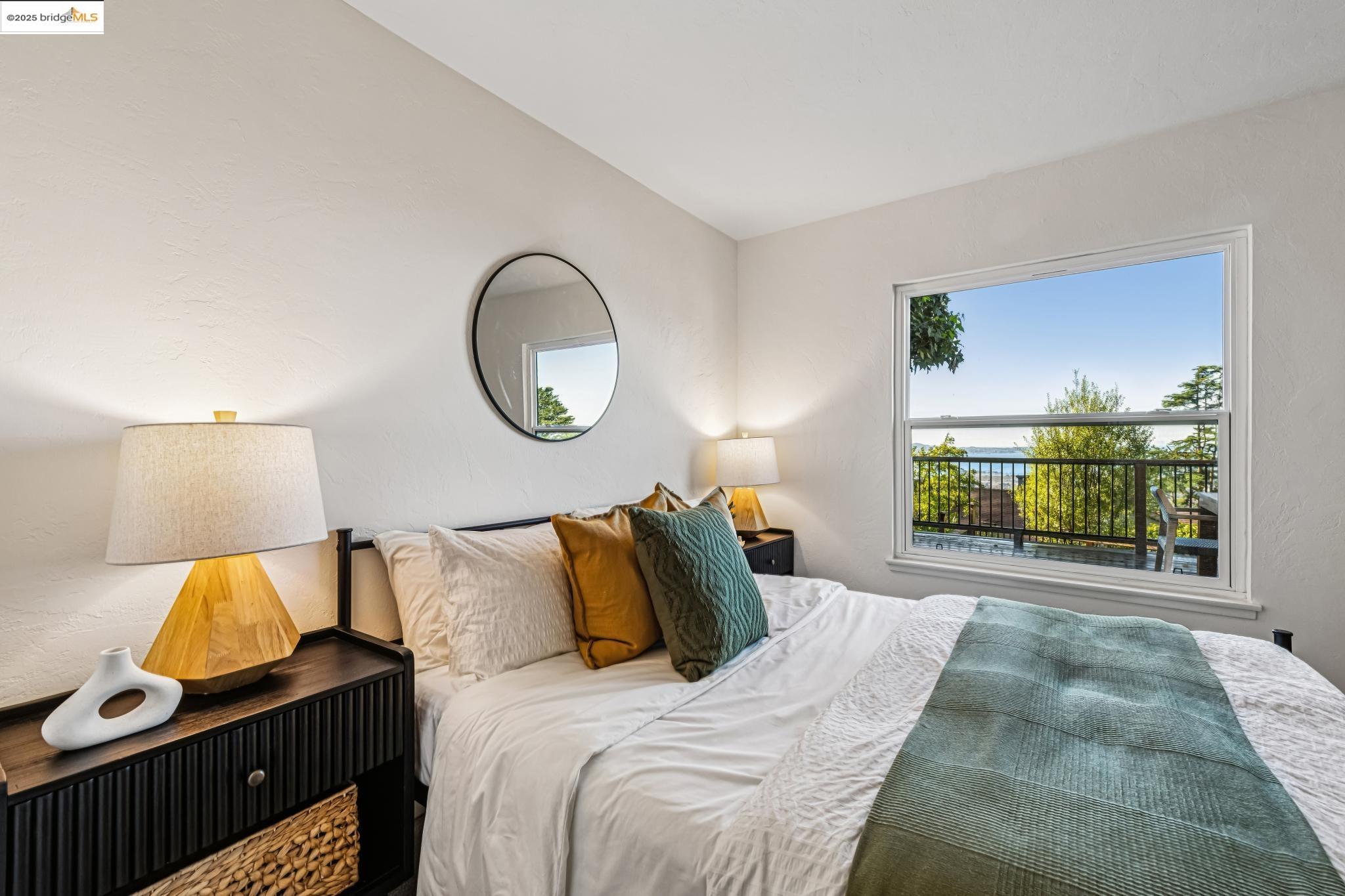 946 Creston Road Berkeley, CA 94708 - Photo 21 of 44 a bed room with a bed and a large window