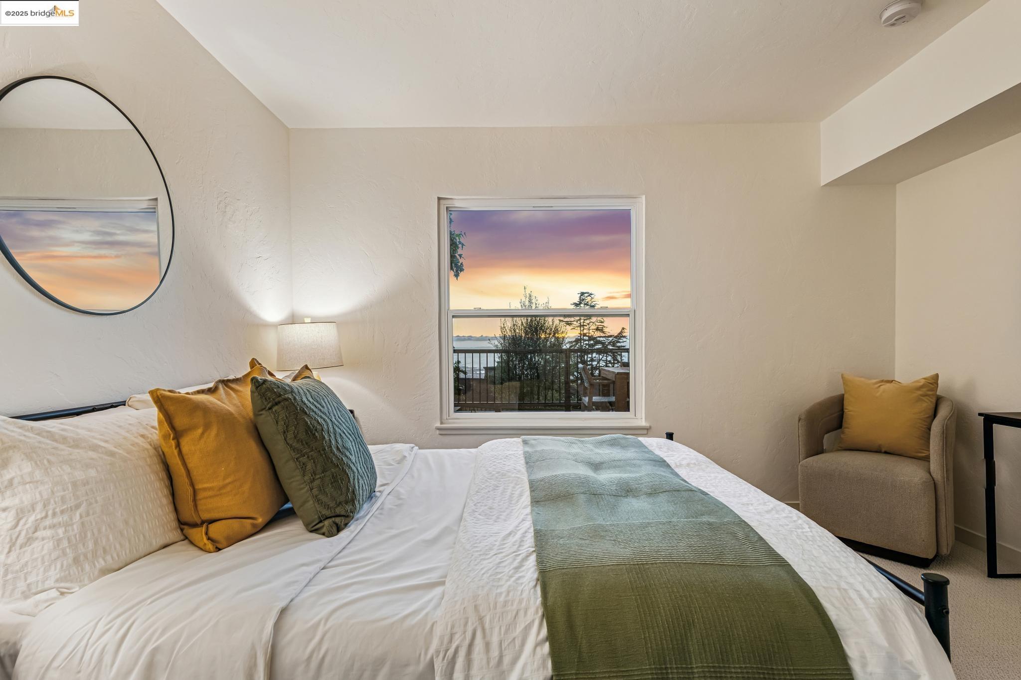 946 Creston Road Berkeley, CA 94708 - Photo 29 of 44 a bedroom with a bed and a window