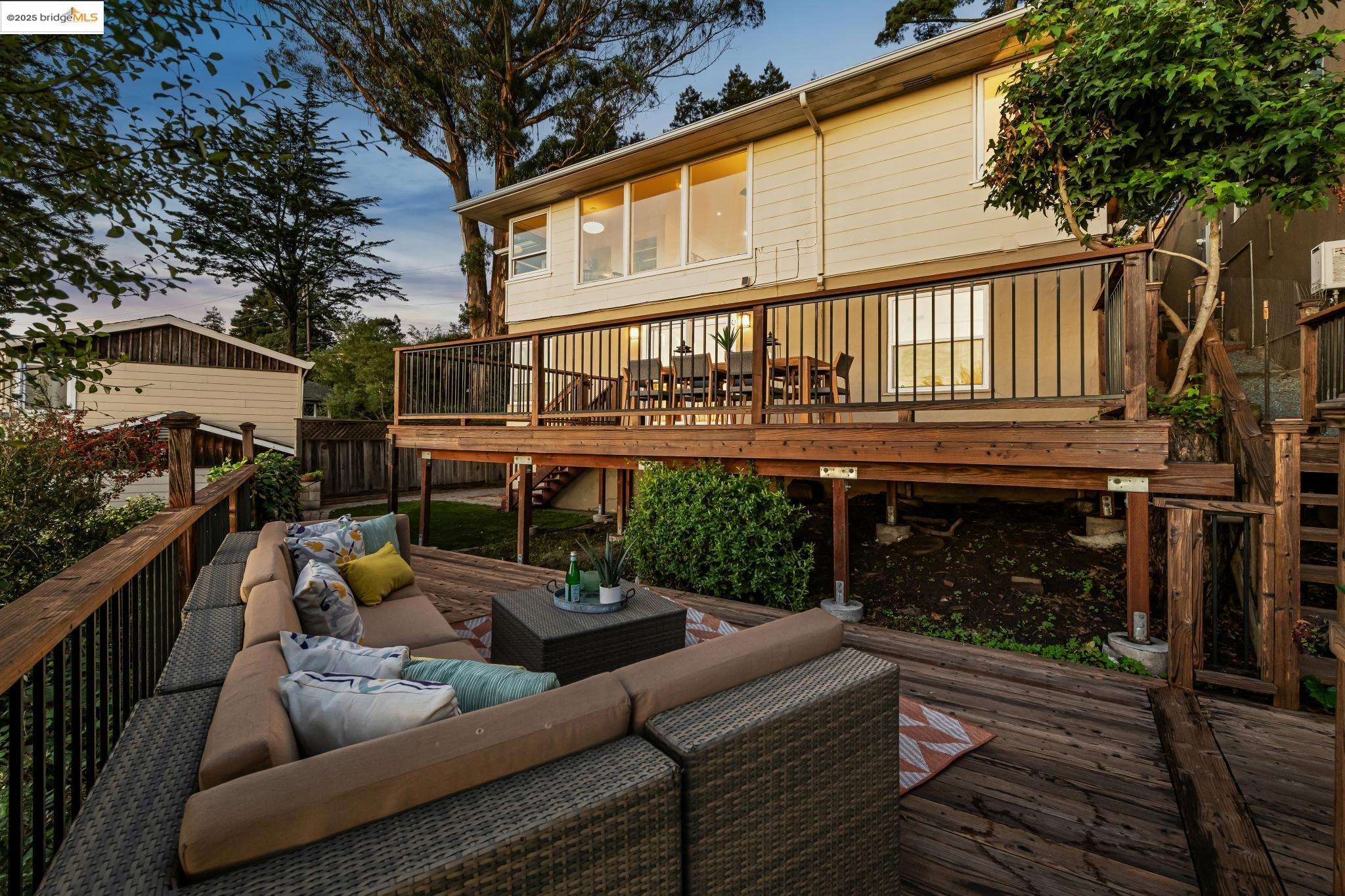 946 Creston Road Berkeley, CA 94708 - Photo 32 of 44 a view of a patio with couches chairs and a fire pit
