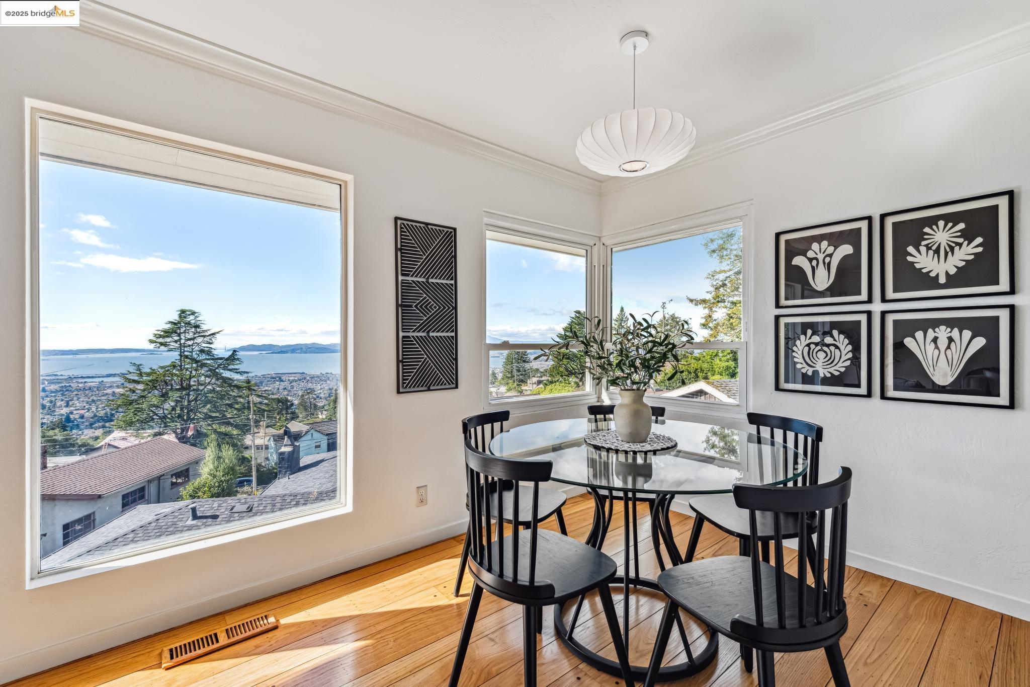 946 Creston Road Berkeley, CA 94708 - Photo 7 of 44 a view of a dining room with furniture window and wooden floor