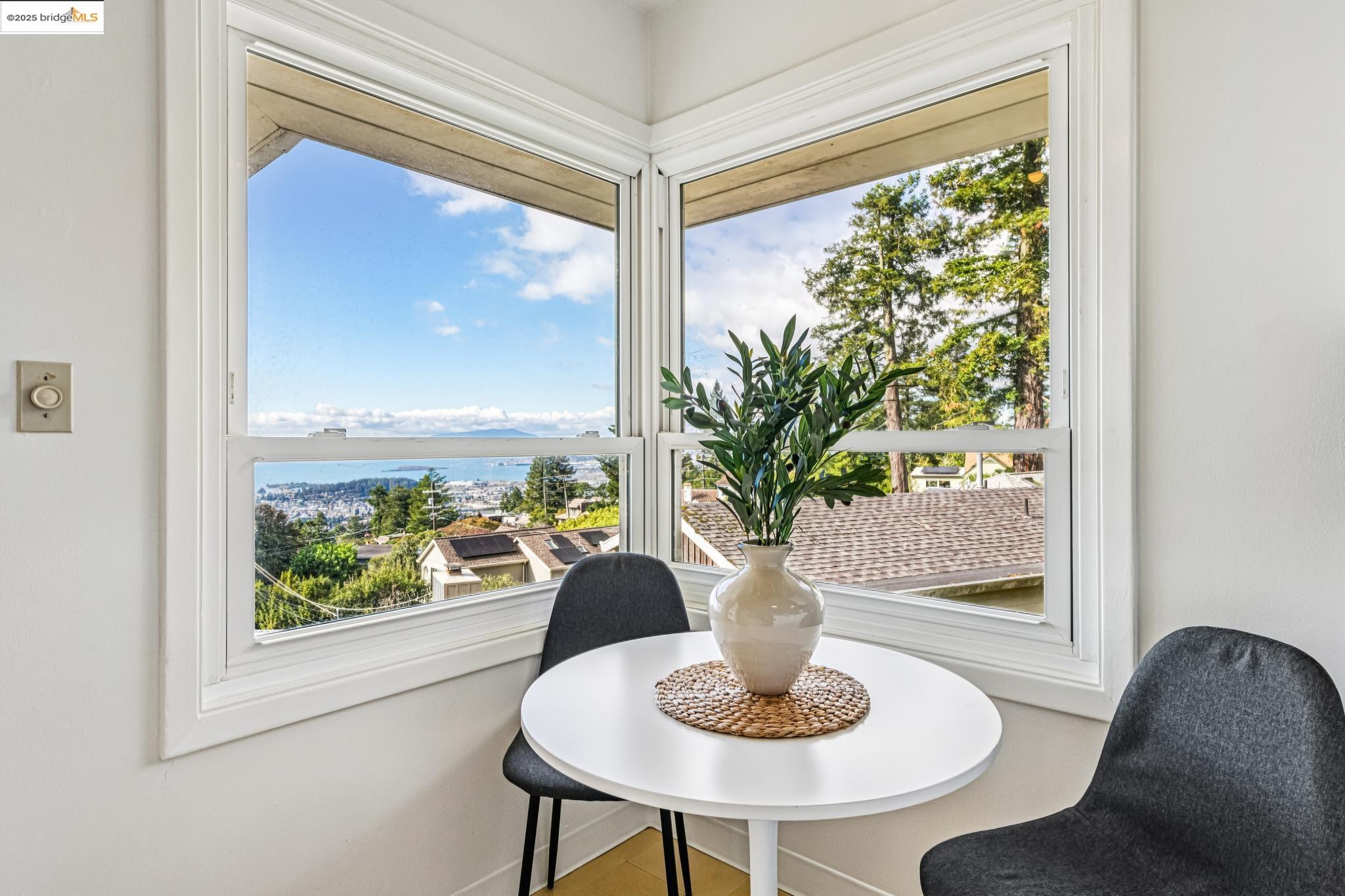 946 Creston Road Berkeley, CA 94708 - Photo 10 of 44 a living room with furniture and a potted plant