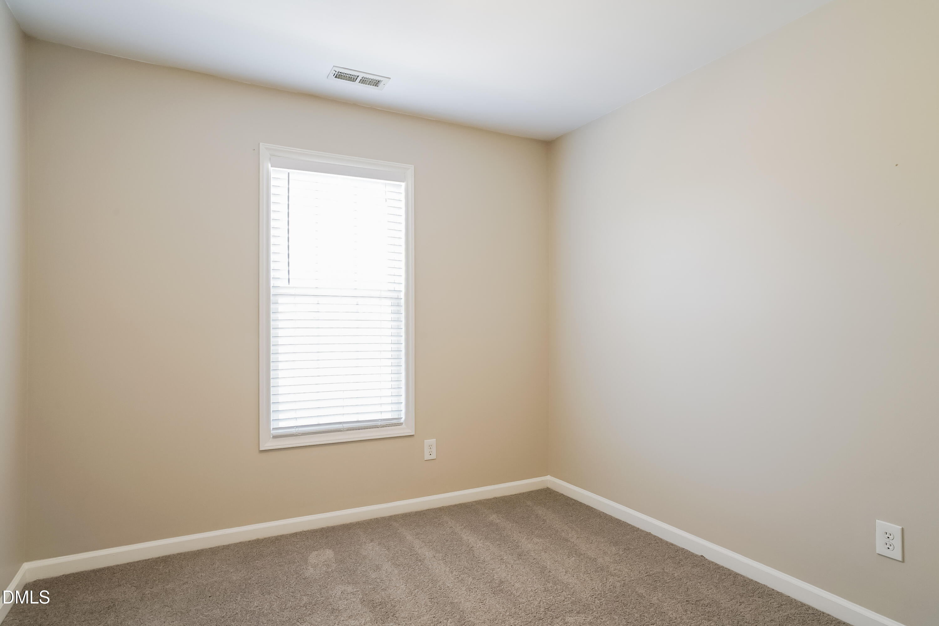 5436 Advantis Drive Raleigh, NC 27610 - Photo 13 of 15 an empty room with a window