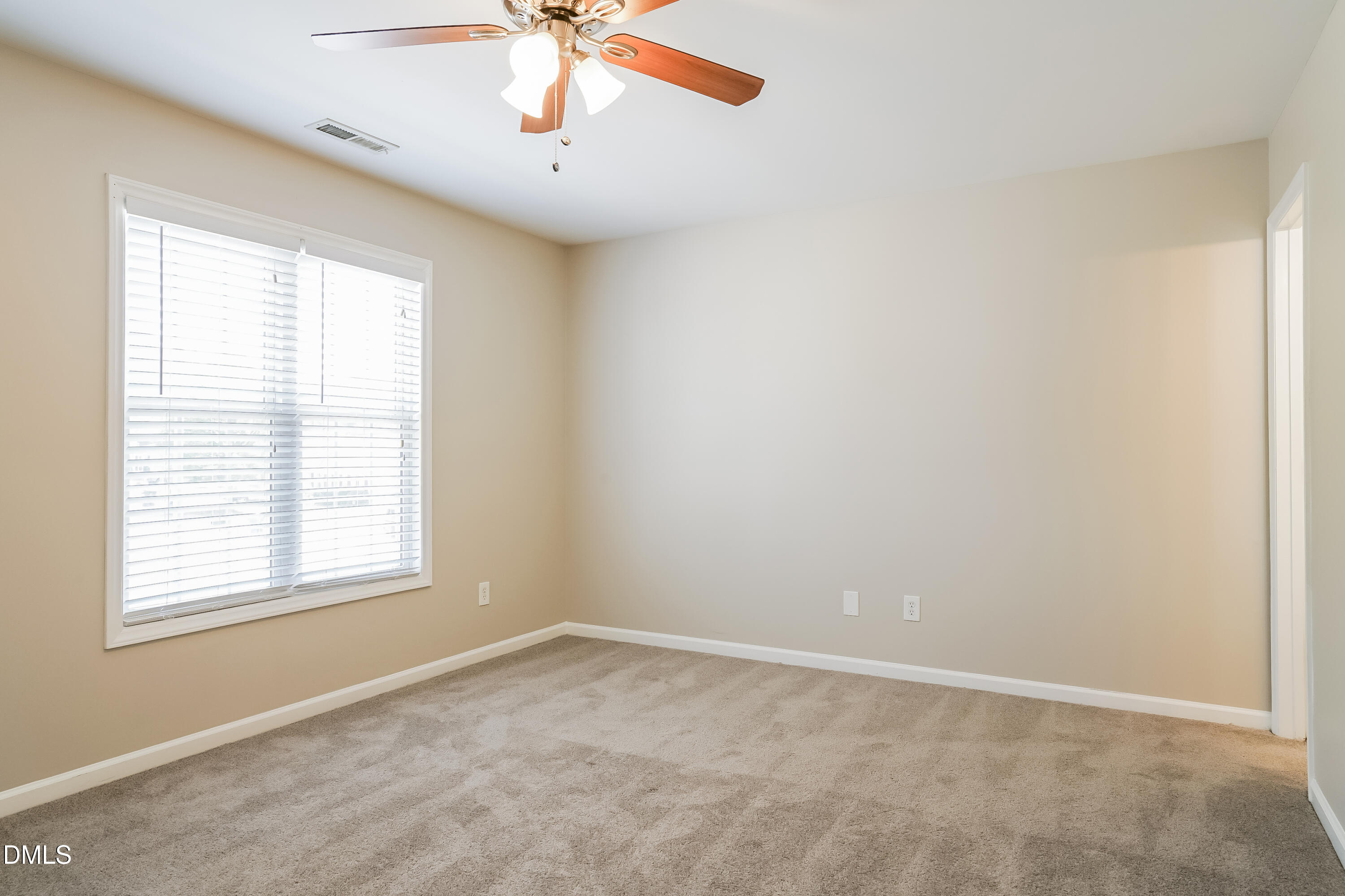 5436 Advantis Drive Raleigh, NC 27610 - Photo 7 of 15 an empty room with a window