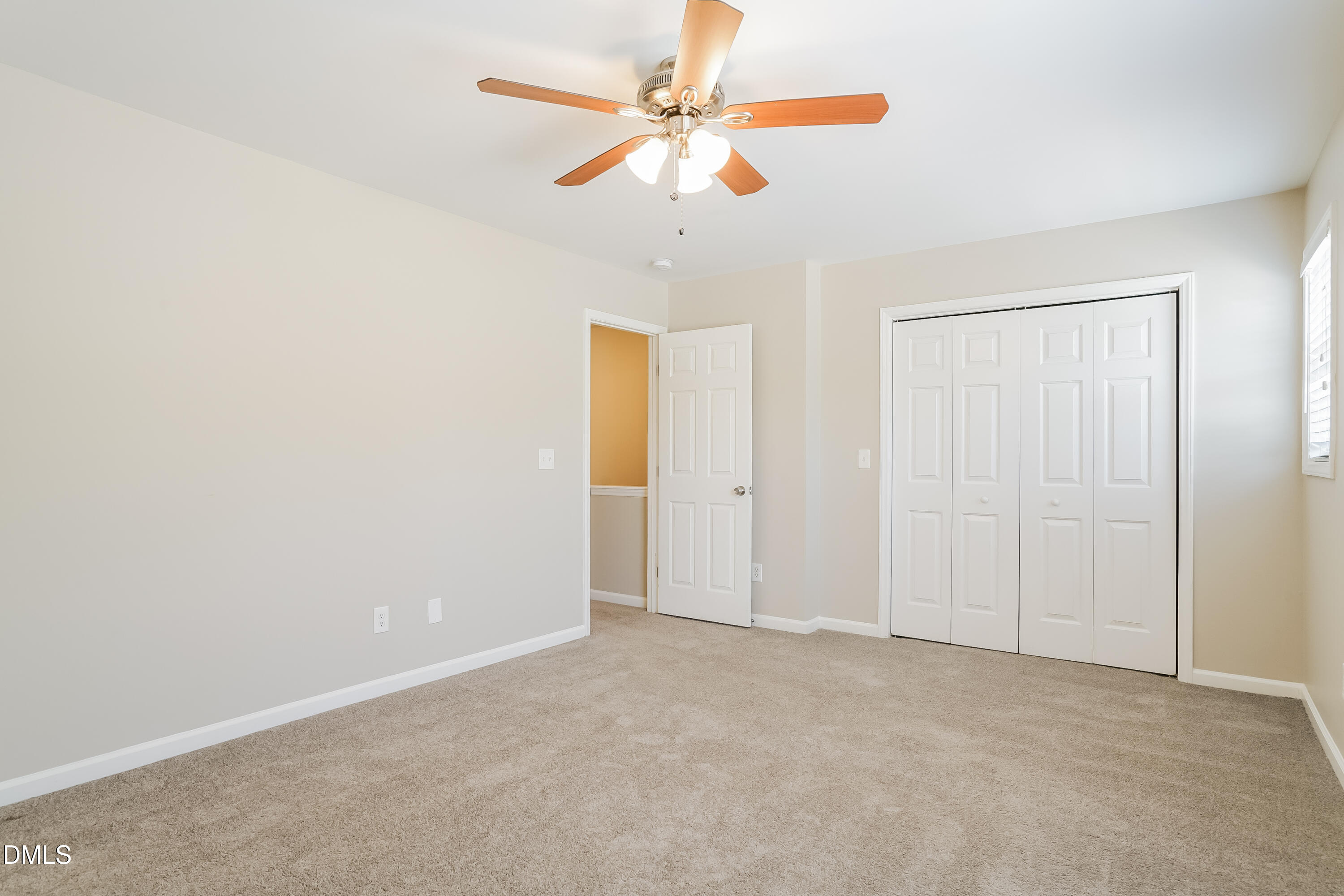 5436 Advantis Drive Raleigh, NC 27610 - Photo 8 of 15 an empty room with closet and fan