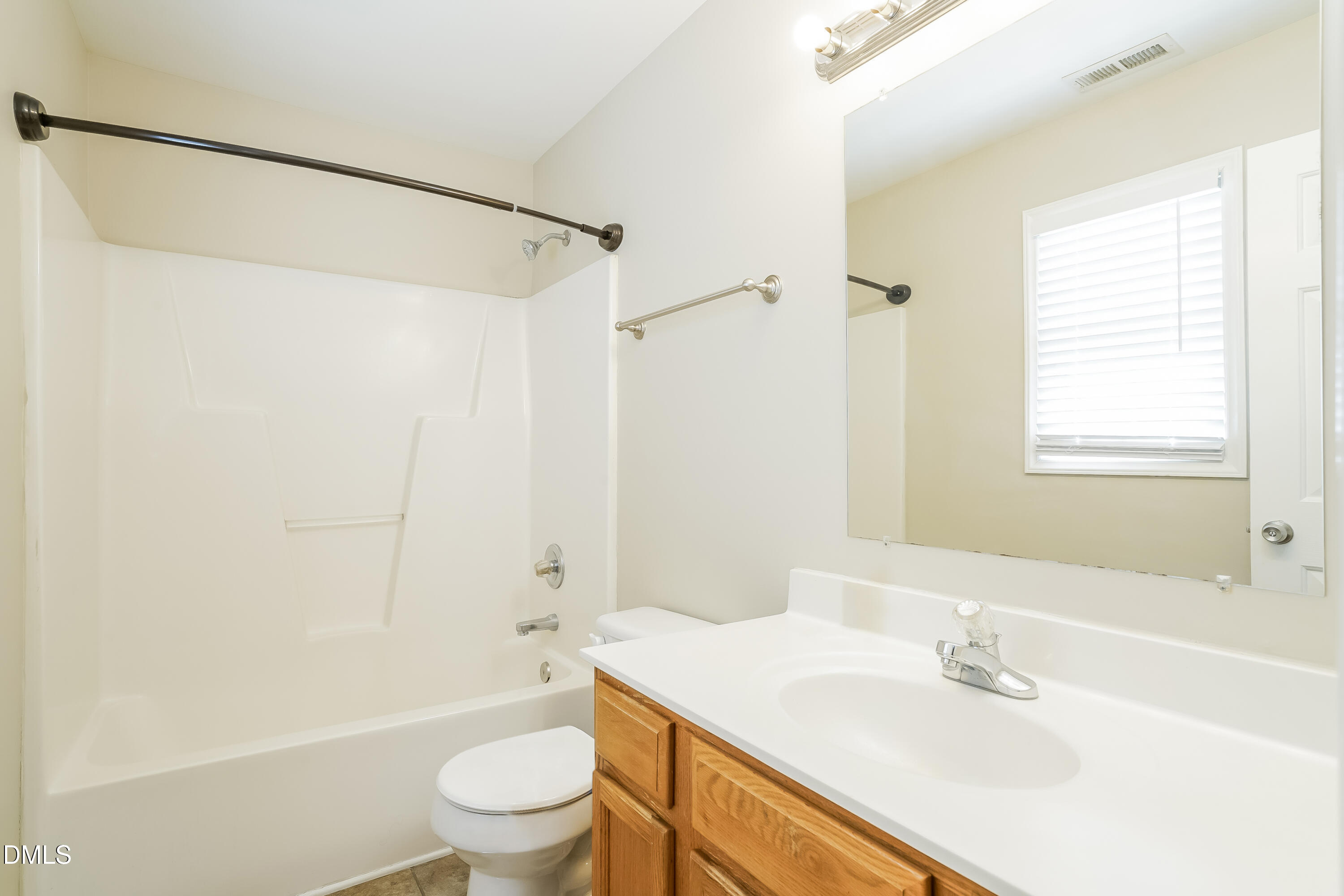 5436 Advantis Drive Raleigh, NC 27610 - Photo 9 of 15 a bathroom with a sink toilet and shower