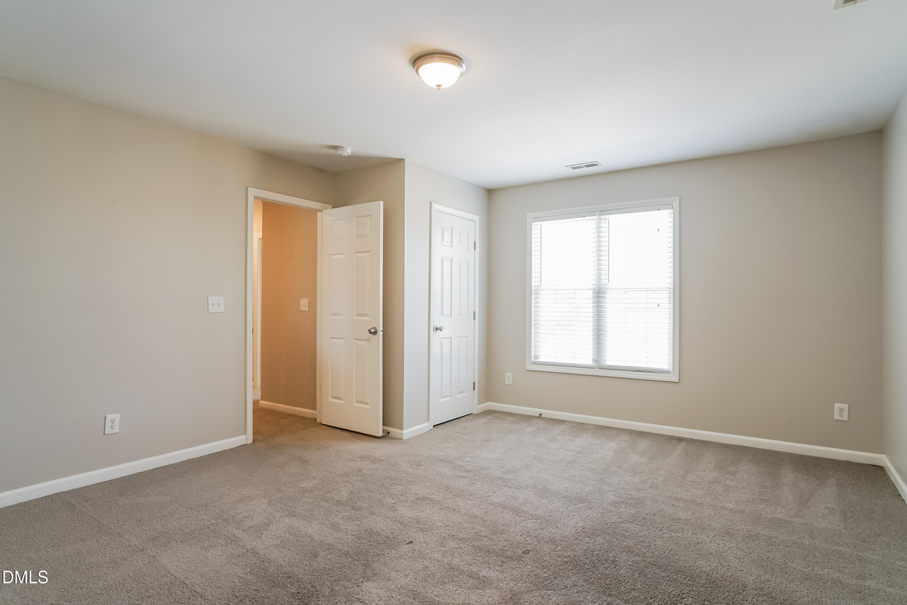 5436 Advantis Drive Raleigh, NC 27610 - Photo 10 of 15 an empty room with a empty space and windows