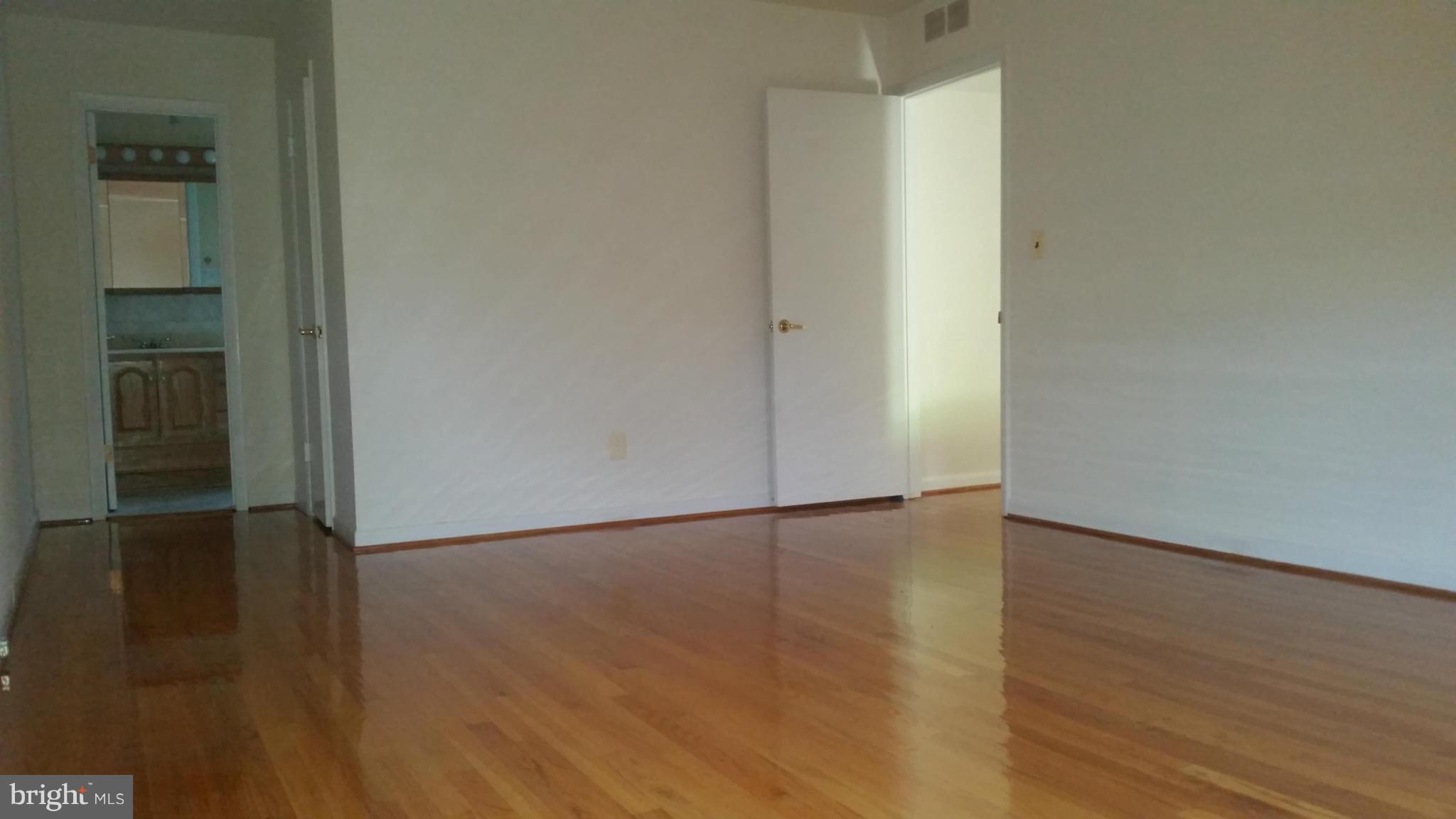 2119 Pot Spring Road Lutherville-Timonium, MD 21093 - Photo 12 of 30 an empty room with wooden floor and closet