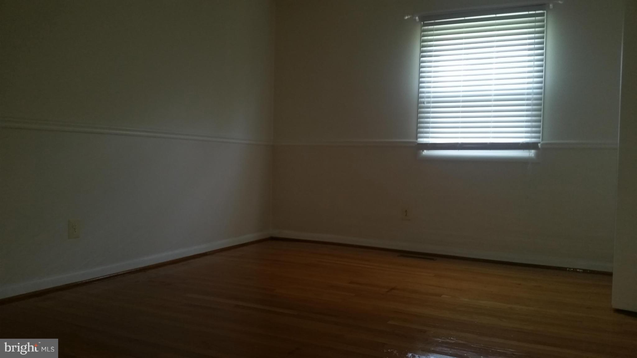 2119 Pot Spring Road Lutherville-Timonium, MD 21093 - Photo 13 of 30 a view of a small space with wooden floor and a window