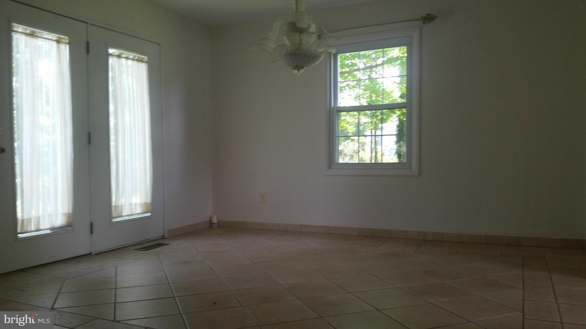 2119 Pot Spring Road Lutherville-Timonium, MD 21093 - Photo 6 of 30 an empty room with windows