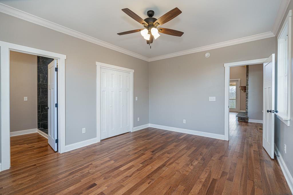 259 River Mountain Road Murphy, NC 28906 - Photo 22 of 42 wooden floor in an empty room with a window