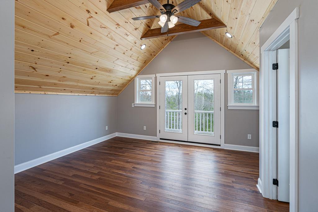259 River Mountain Road Murphy, NC 28906 - Photo 28 of 42 a view of an empty room with wooden floor and a window