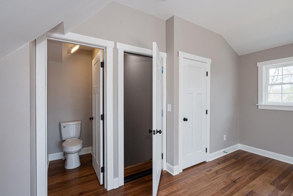 259 River Mountain Road Murphy, NC 28906 - Photo 31 of 42 a view of a bathroom with toilet window and wooden floor