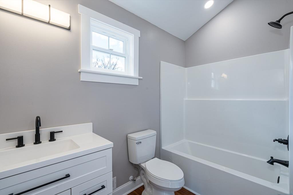 259 River Mountain Road Murphy, NC 28906 - Photo 32 of 42 a white toilet sitting next to a bathroom sink