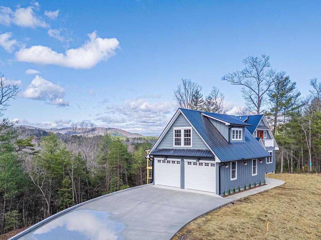 259 River Mountain Road Murphy, NC 28906 - Photo 4 of 42 a front view of a house with a yard