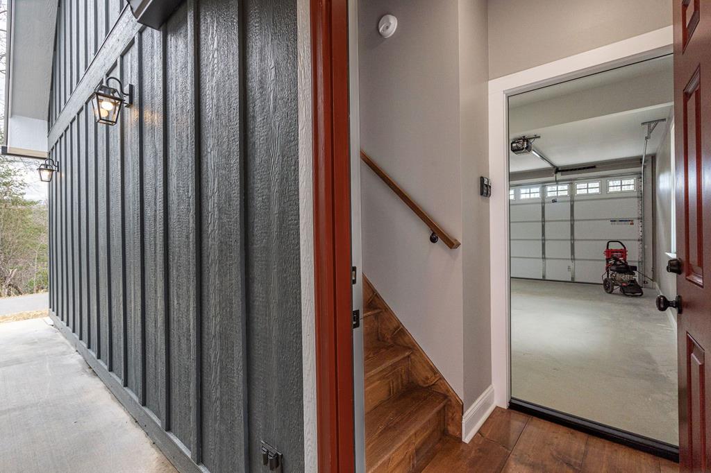 259 River Mountain Road Murphy, NC 28906 - Photo 6 of 42 a view of a hallway with wooden floor and staircase