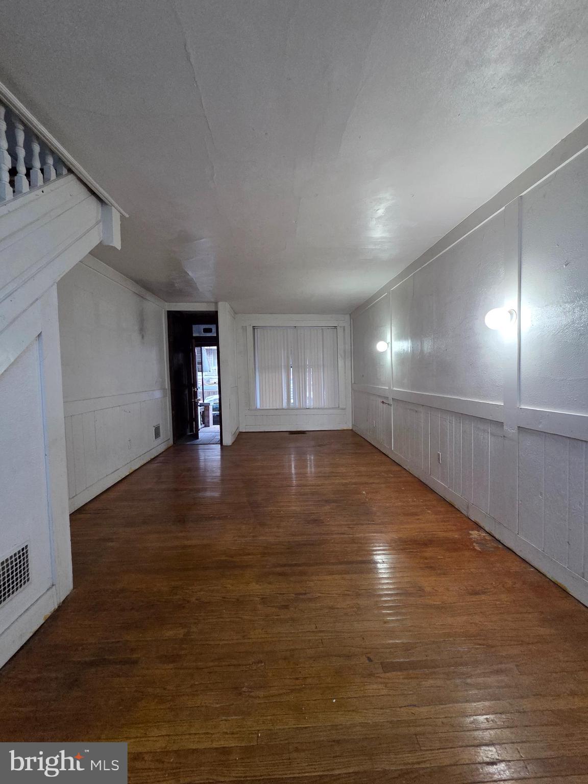 1024 North 11th Street Reading, PA 19604 - Photo 12 of 23 a view of an empty room with wooden floor