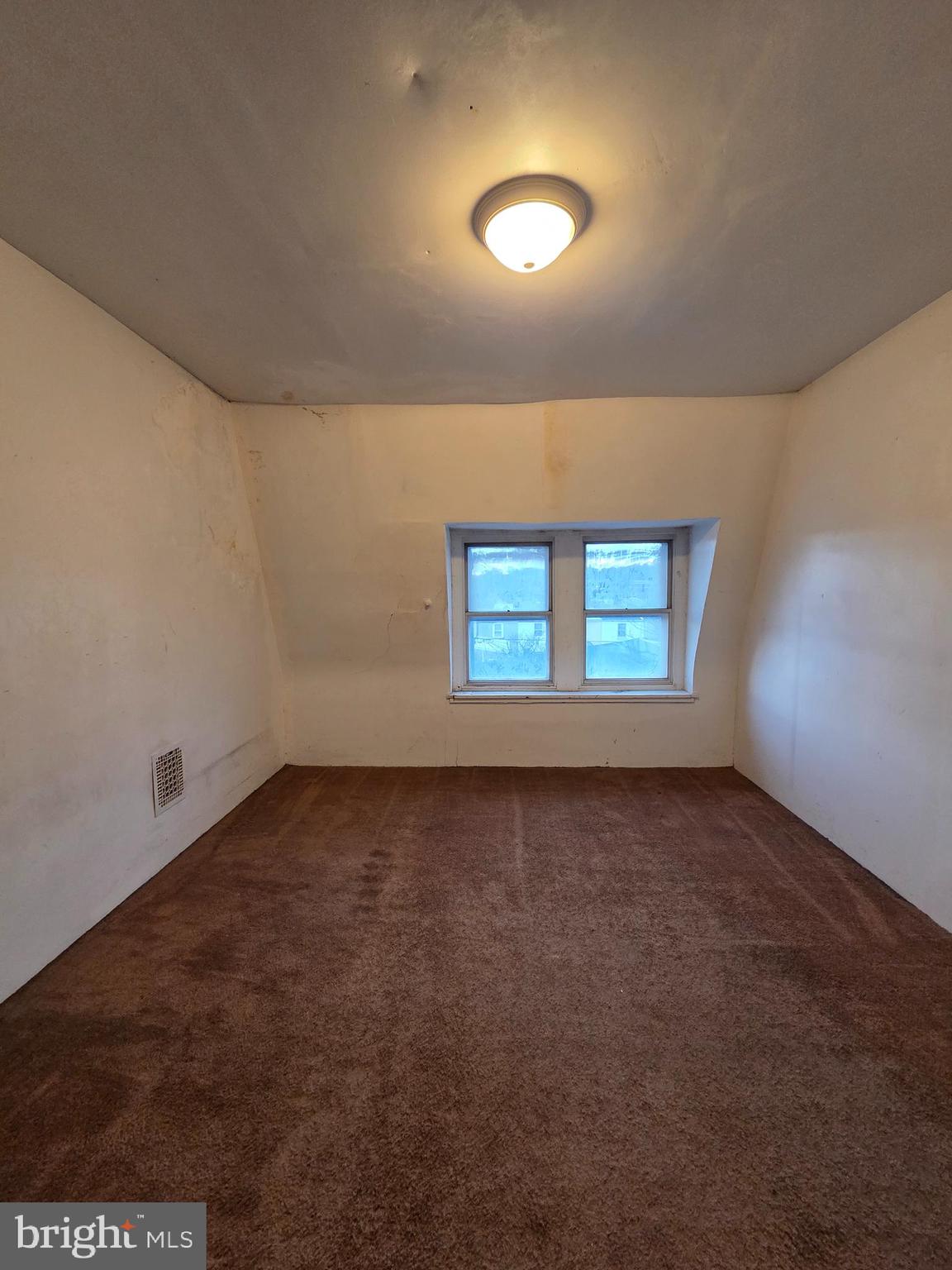 1024 North 11th Street Reading, PA 19604 - Photo 17 of 23 an empty room with a empty space and windows