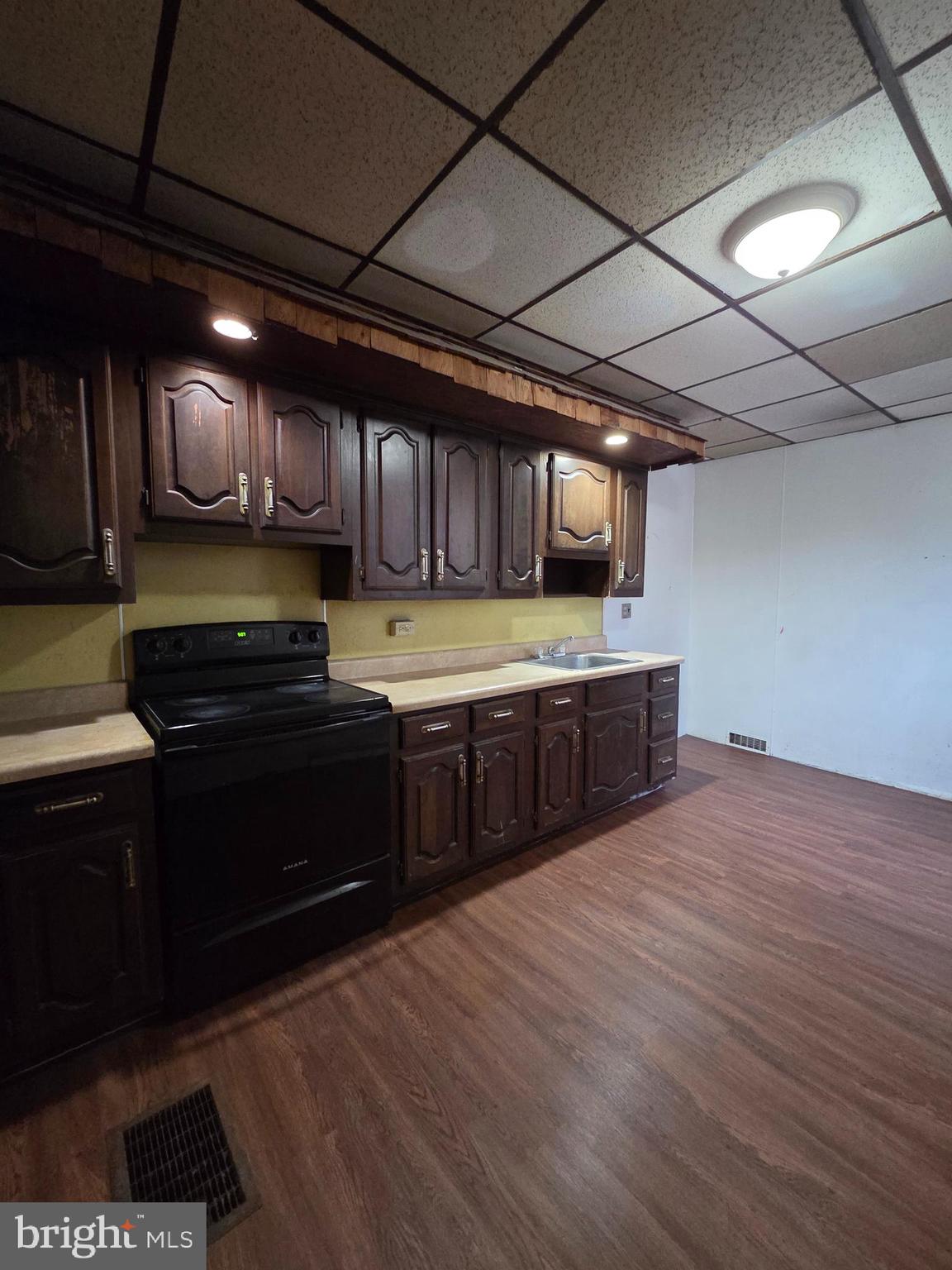 1024 North 11th Street Reading, PA 19604 - Photo 5 of 23 a kitchen with stainless steel appliances granite countertop a stove a sink and a microwave