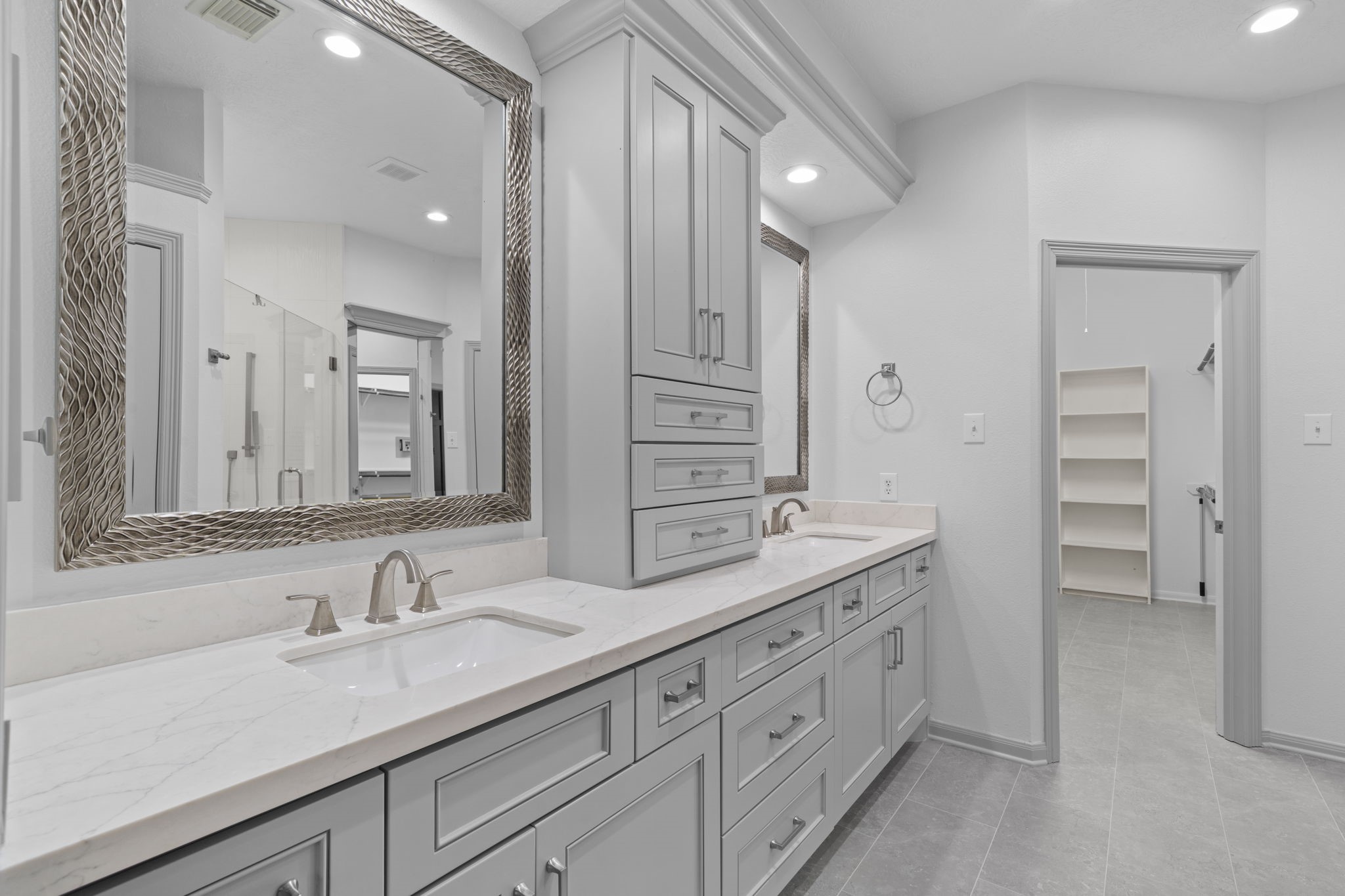 226 Whispering Ridge Terrace Houston, TX 77094 - Photo 14 of 31 a bathroom with double sink and a mirror