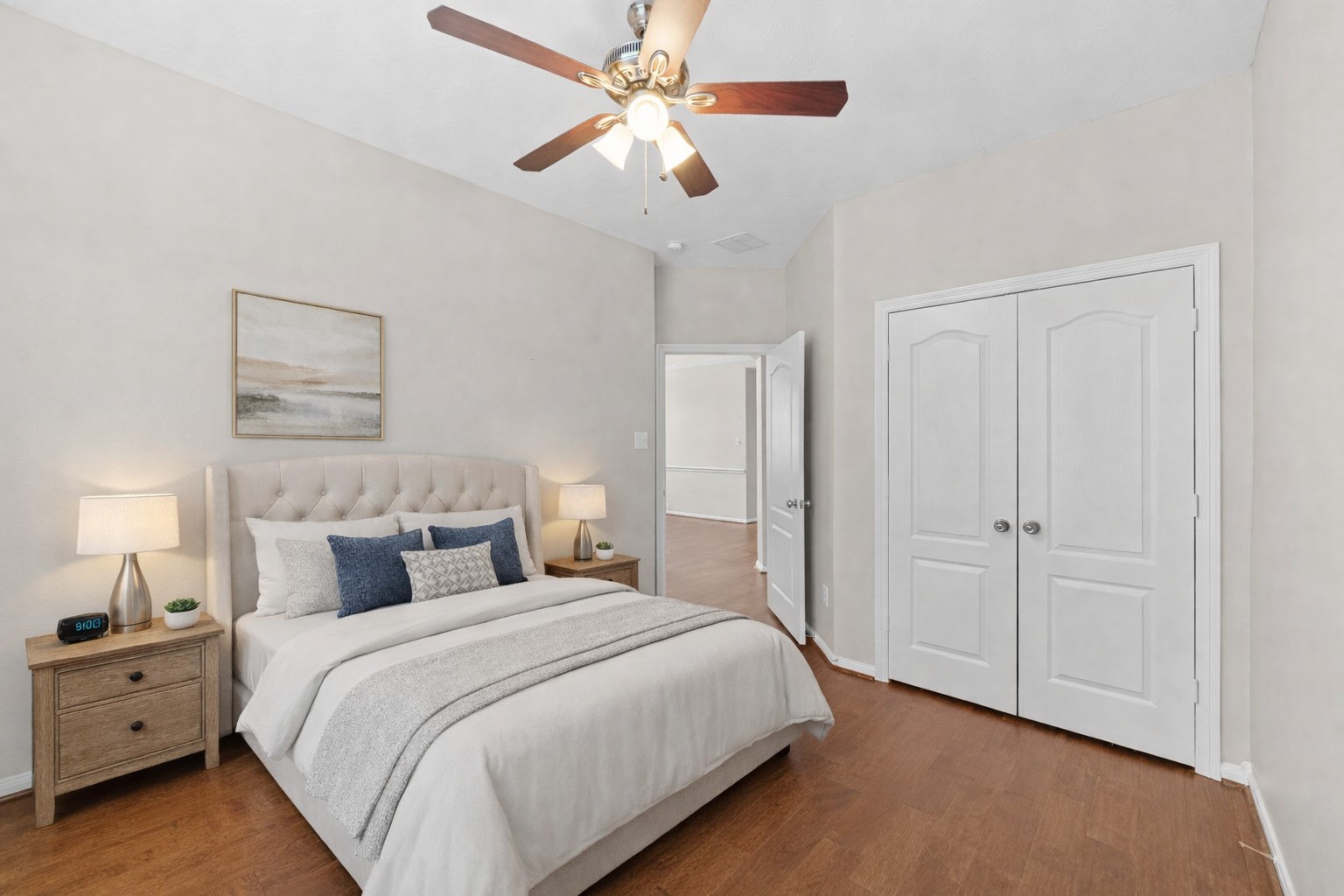 226 Whispering Ridge Terrace Houston, TX 77094 - Photo 17 of 31 a bedroom with a bed and a chandelier