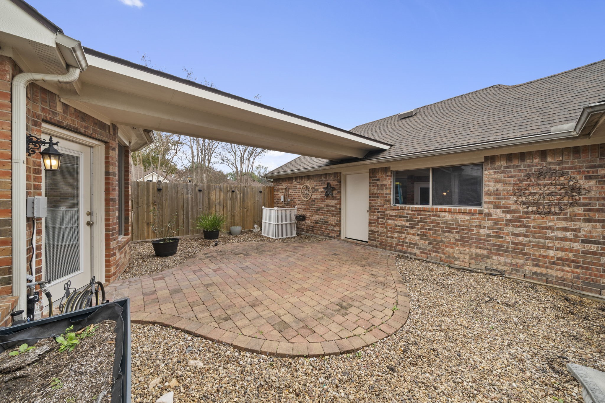 226 Whispering Ridge Terrace Houston, TX 77094 - Photo 22 of 31 a view of a house with backyard and porch