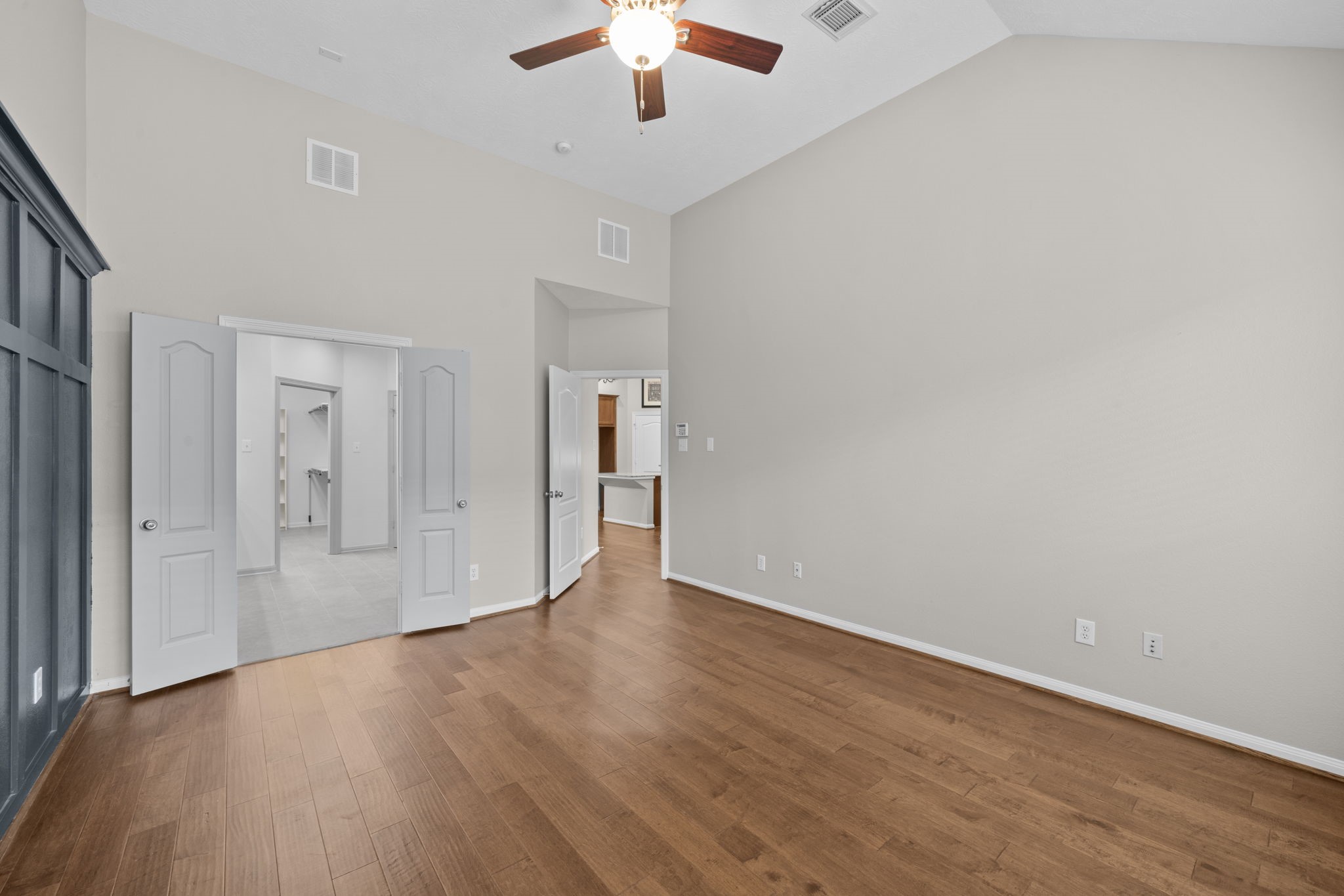 226 Whispering Ridge Terrace Houston, TX 77094 - Photo 30 of 31 wooden floor in an empty room with a window