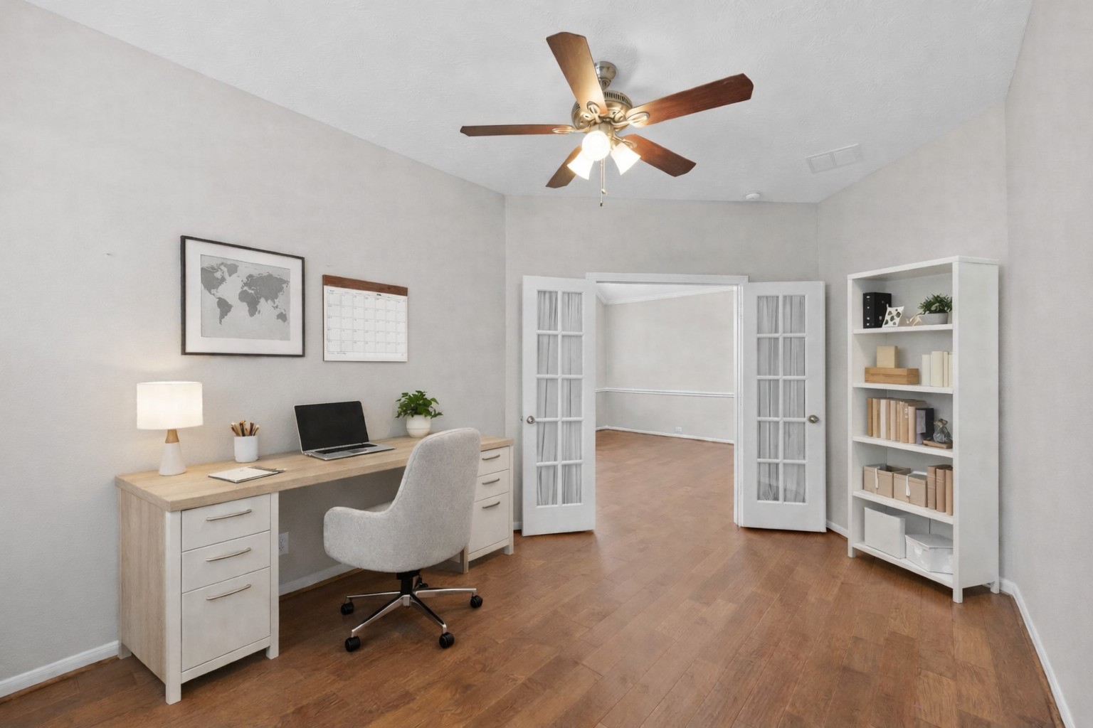 226 Whispering Ridge Terrace Houston, TX 77094 - Photo 4 of 31 a workspace with wooden floor and white cabinet