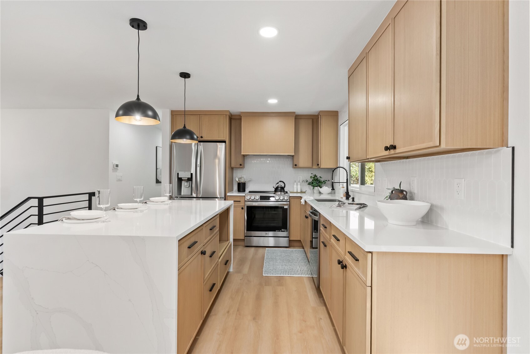 9548 3rd Avenue Northwest Seattle, WA 98117 - Photo 13 of 40 a kitchen with a sink stove and cabinets