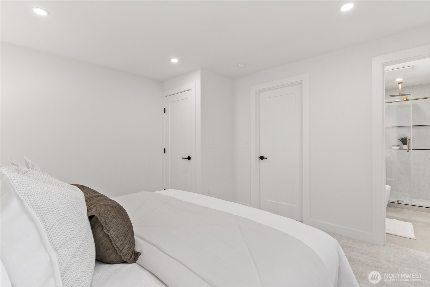 9548 3rd Avenue Northwest Seattle, WA 98117 - Photo 22 of 40 a bedroom with a bed and utility room