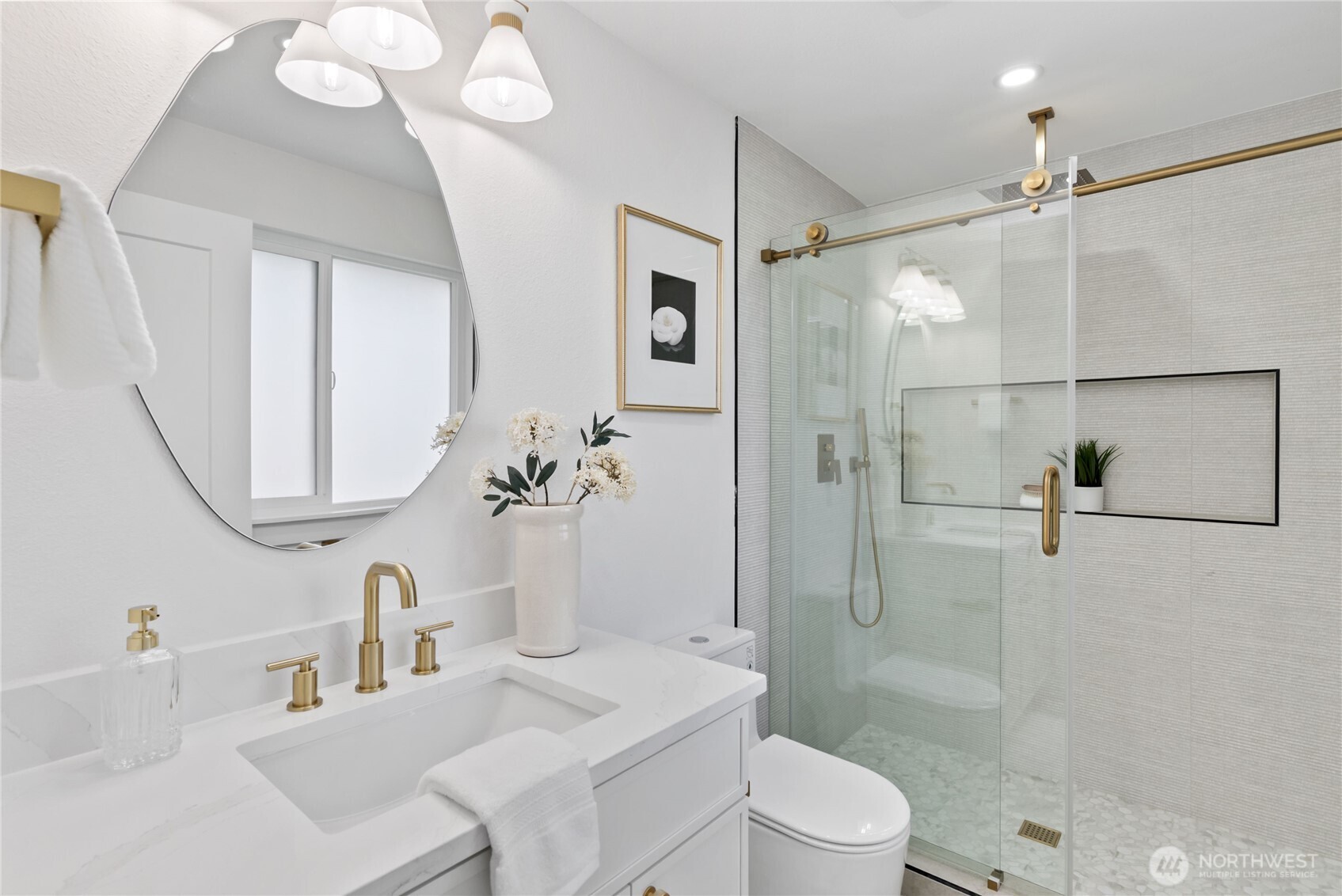 9548 3rd Avenue Northwest Seattle, WA 98117 - Photo 24 of 40 a bathroom with a sink a toilet and shower