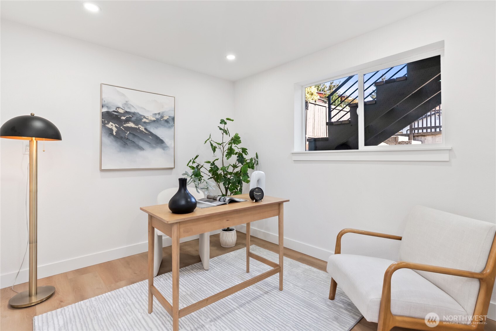 9548 3rd Avenue Northwest Seattle, WA 98117 - Photo 28 of 40 a living room with furniture and a potted plant