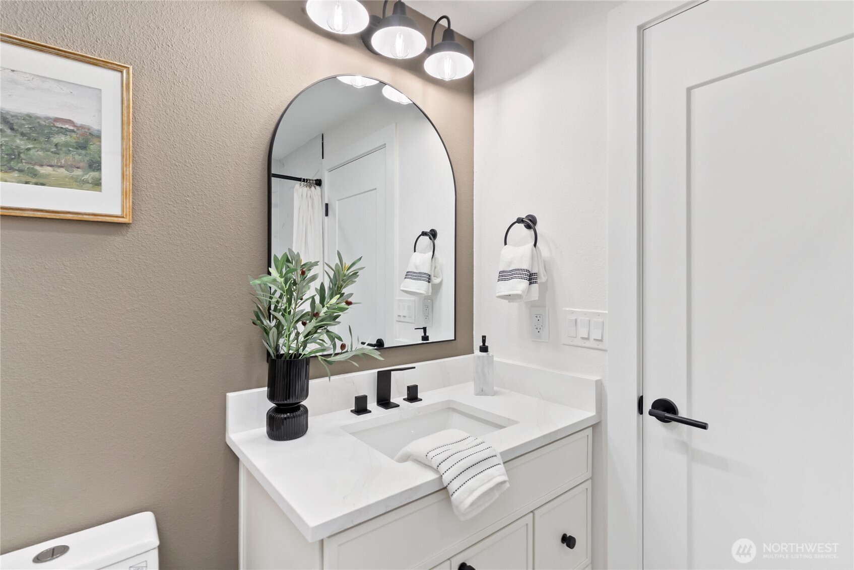 9548 3rd Avenue Northwest Seattle, WA 98117 - Photo 30 of 40 a bathroom with a sink and a mirror