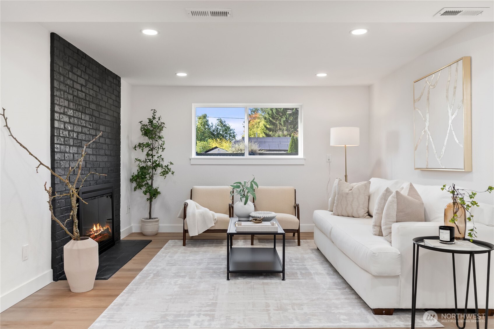 9548 3rd Avenue Northwest Seattle, WA 98117 - Photo 31 of 40 a living room with furniture and a potted plant