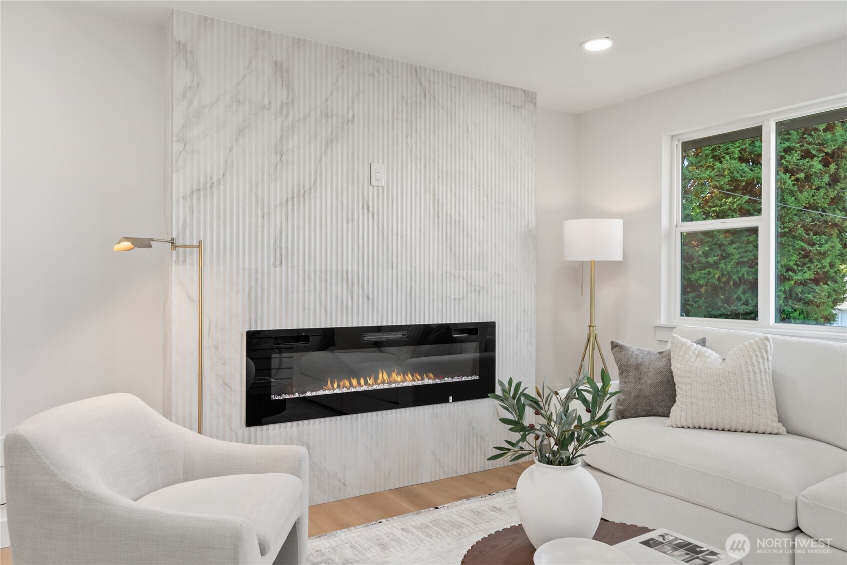 9548 3rd Avenue Northwest Seattle, WA 98117 - Photo 9 of 40 a living room with furniture a large window and a fireplace