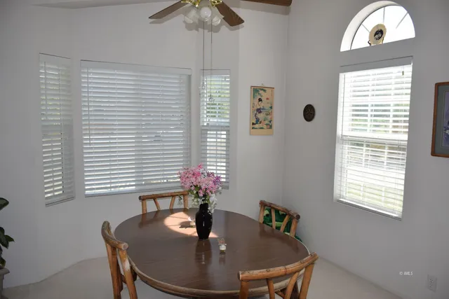 a dining room with a table and chairs