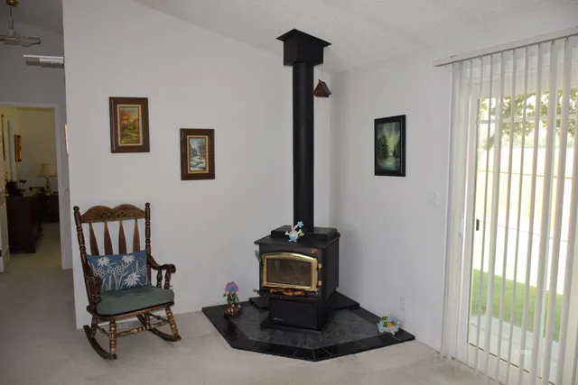 a view of a livingroom with furniture and a window
