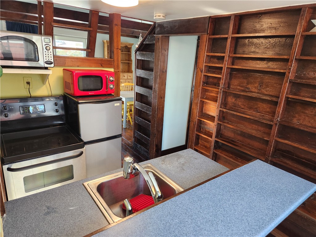 8 Atlantic Avenue Narragansett, RI 02882 - Photo 8 of 11 Lots of open shelving storage in the kitchen