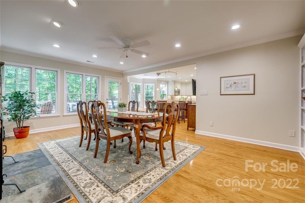 29008 Silver Fox Drive Tega Cay, SC 29708 - Photo 11 of 48 a view of a dining room with furniture window and wooden floor