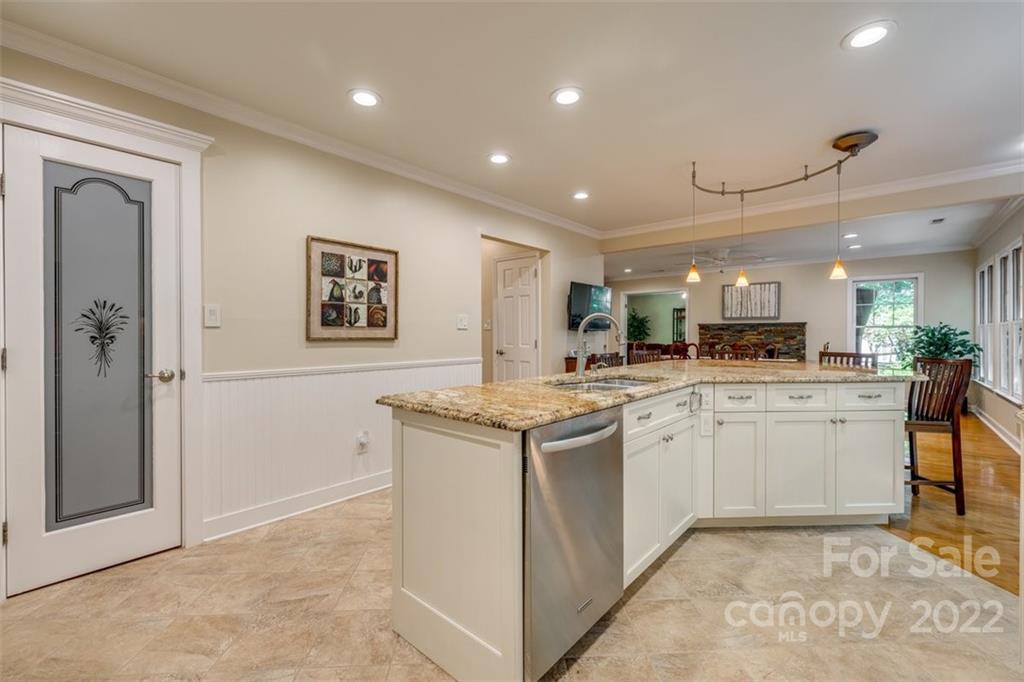 29008 Silver Fox Drive Tega Cay, SC 29708 - Photo 17 of 48 a kitchen with granite countertop cabinets and refrigerator