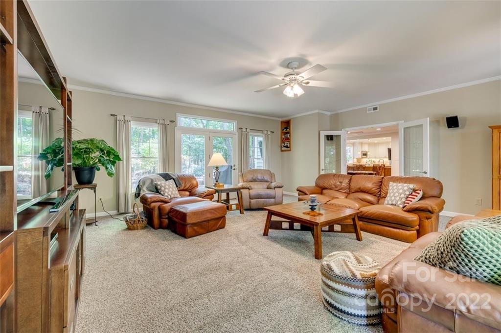 29008 Silver Fox Drive Tega Cay, SC 29708 - Photo 20 of 48 a living room with furniture and a large window