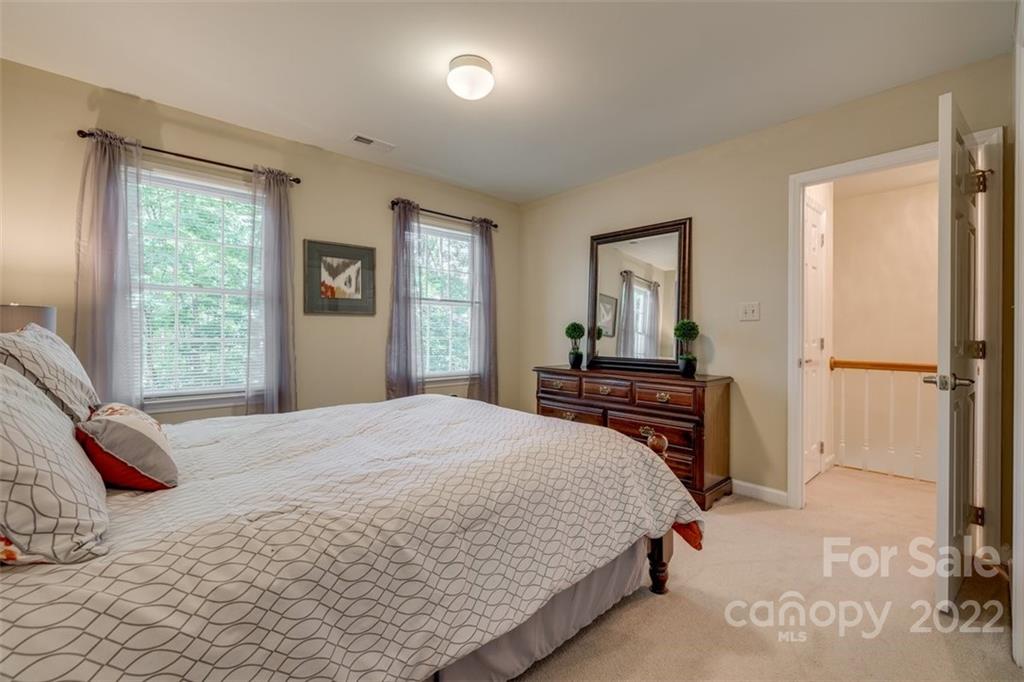 29008 Silver Fox Drive Tega Cay, SC 29708 - Photo 30 of 48 a bedroom with a bed and a window